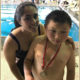 A special needs swimmer, and an equally enthusiastic volunteer.
