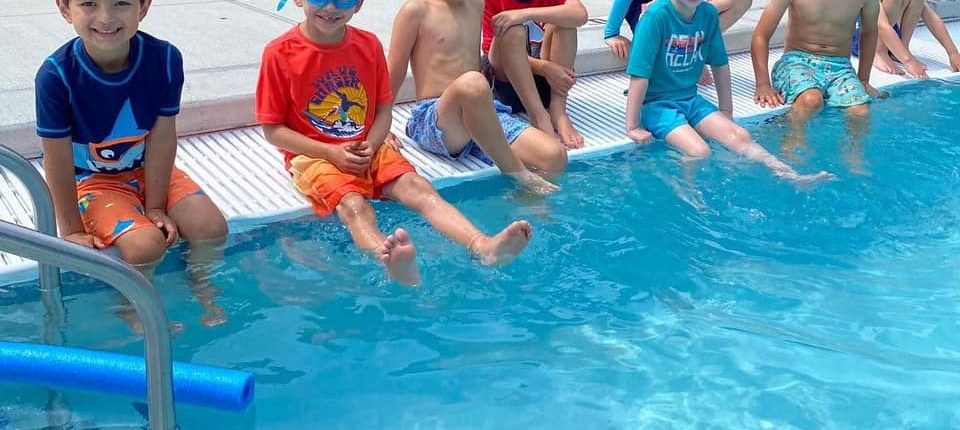 boys at outdoor pool at Westport Weston Family YMCA