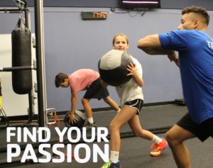 Find Your Passion Teen Conditioning_Feature Image Teen athlete with trainer using medicine ball at Westport Weston Family YMCA