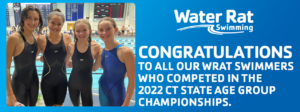Winning competitive teen swimmers at YMCA pool smiling