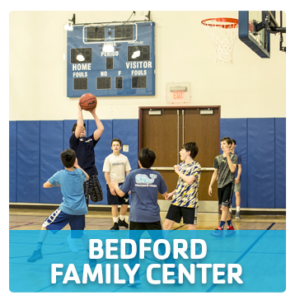 Westport Weston YMCA Bedford Family Center full size gymnasium with boys playing basketball